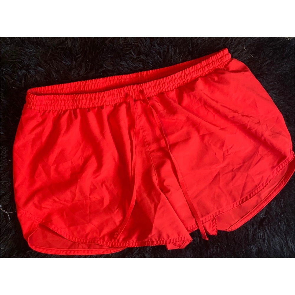 TWO pairs of athletic shorts